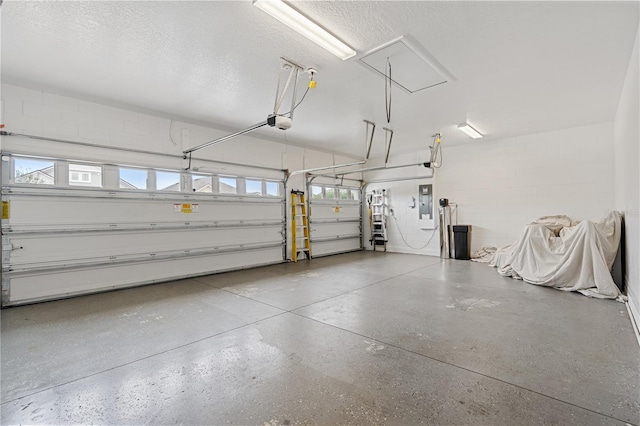 garage with electric panel, concrete block wall, and a garage door opener