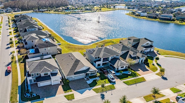 bird's eye view featuring a water view and a residential view