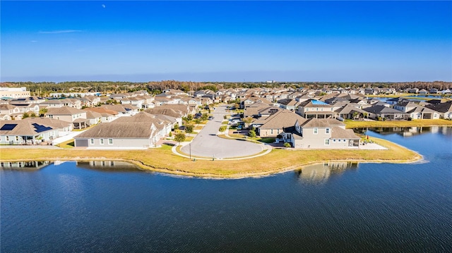 birds eye view of property with a water view and a residential view