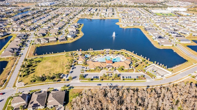 bird's eye view with a water view and a residential view