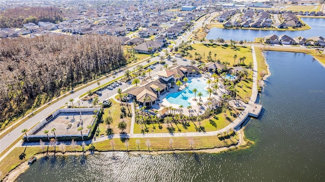 bird's eye view with a water view and a residential view