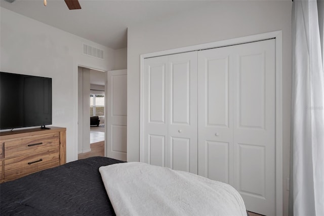 bedroom featuring a ceiling fan, a closet, and visible vents