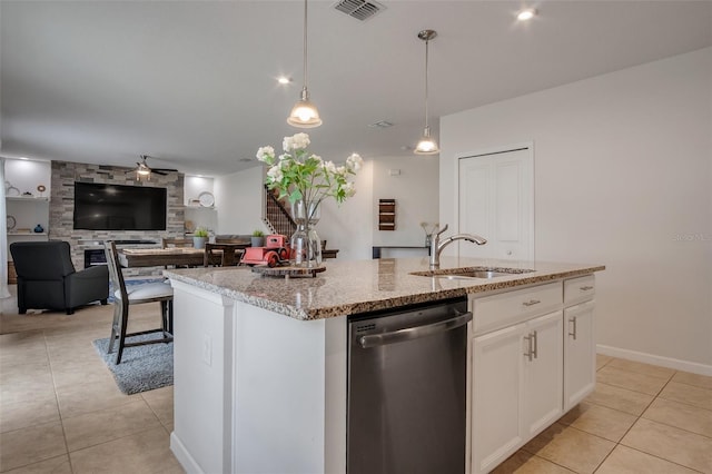kitchen featuring ceiling fan, visible vents, dishwasher, a sink, and light tile patterned floors
