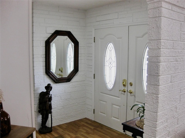 7026 Lenape Cir, New Port Richey, FL 34653 - entryway featuring dark wood-style flooring