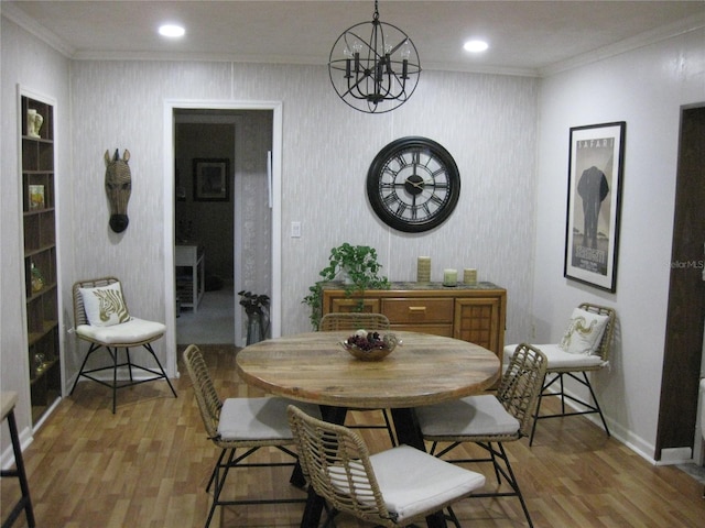 7026 Lenape Cir, New Port Richey, FL 34653 - dining space with light wood-style flooring, a chandelier, ornamental molding, and recessed lighting