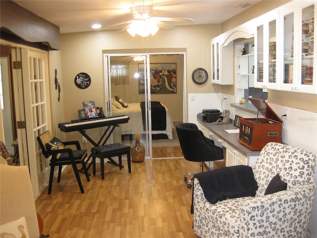7026 Lenape Cir, New Port Richey, FL 34653 - home office with a ceiling fan and light wood-style flooring