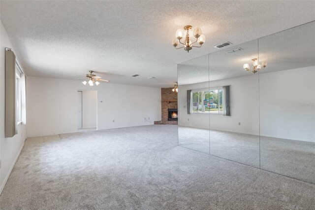 10980 SW 62nd Ave, Ocala, FL 34476 - unfurnished living room featuring carpet floors, a brick fireplace, a textured ceiling, and visible vents