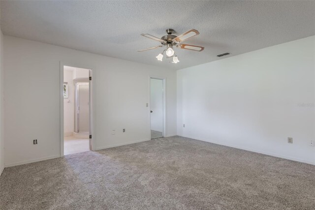 10980 SW 62nd Ave, Ocala, FL 34476 - carpeted spare room with baseboards, a ceiling fan, a textured ceiling, and visible vents