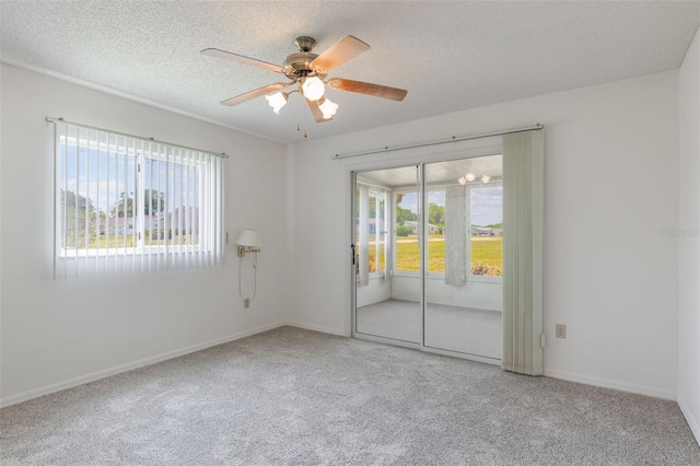 10980 SW 62nd Ave, Ocala, FL 34476 - carpeted spare room with baseboards, a textured ceiling, and ceiling fan