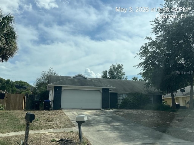 7614 Brisbane Ct, Orlando, FL 32835 - single story home featuring a garage, fence, and driveway