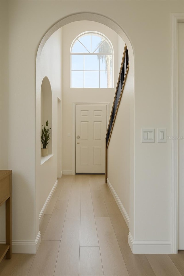 foyer entrance with baseboards