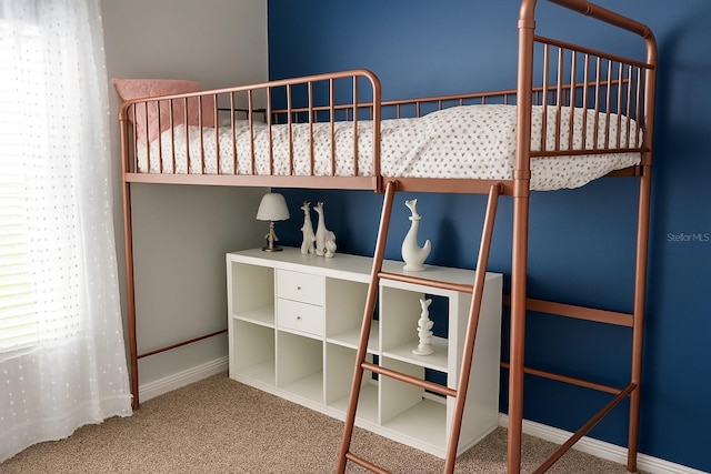 unfurnished bedroom with baseboards and carpet floors