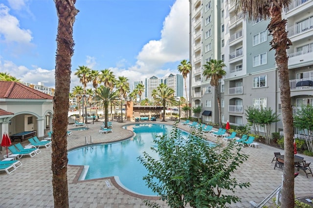 7395 Universal Blvd Unit 203, Orlando, FL 32819 - community pool featuring a patio