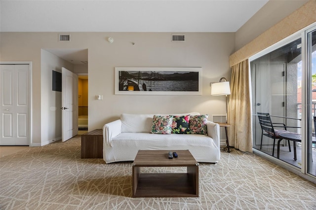 7395 Universal Blvd Unit 203, Orlando, FL 32819 - carpeted living area with baseboards and visible vents