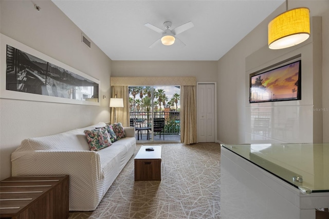 7395 Universal Blvd Unit 203, Orlando, FL 32819 - living room featuring visible vents and a ceiling fan