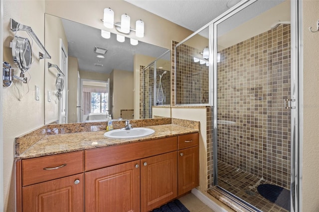 7395 Universal Blvd Unit 203, Orlando, FL 32819 - bathroom with a stall shower, vanity, and tile patterned floors