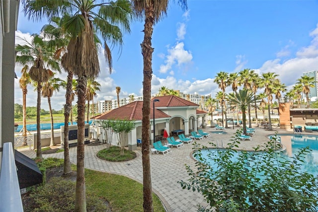 7395 Universal Blvd Unit 203, Orlando, FL 32819 - exterior space featuring a patio and a community pool