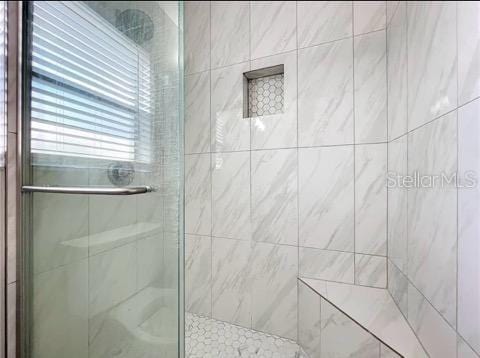 full bathroom featuring a stall shower