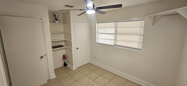 washroom with light tile patterned floors, baseboards, ceiling fan, and visible vents