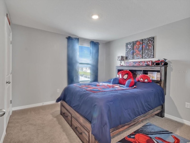 bedroom with baseboards and carpet floors