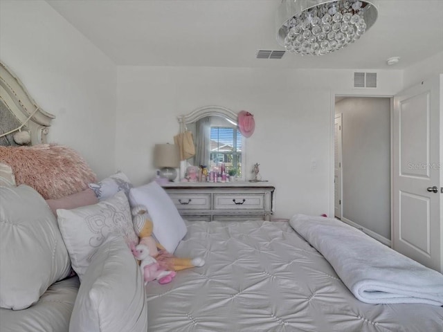 bedroom featuring visible vents