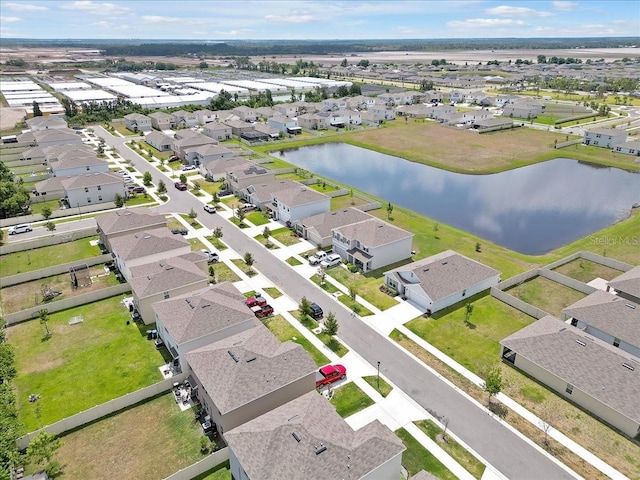 bird's eye view with a water view and a residential view