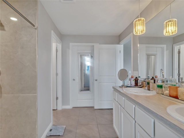 5289 Fiddle Fig Ave, Wimauma, FL 33598 - full bath with tile patterned flooring, double vanity, a chandelier, and a shower