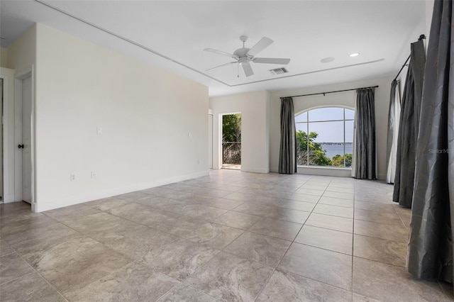 empty room with visible vents, a ceiling fan, baseboards, and recessed lighting