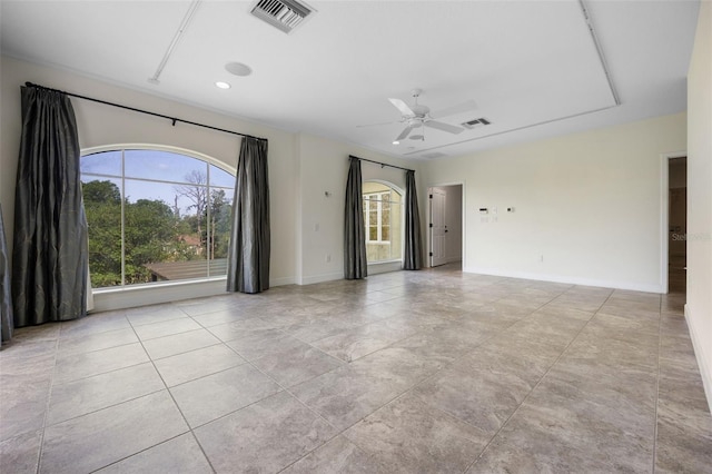 tiled empty room featuring visible vents, recessed lighting, baseboards, and ceiling fan