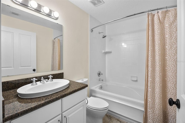 full bath with visible vents, toilet, shower / tub combo, and vanity
