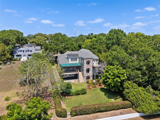 drone / aerial view featuring a view of trees
