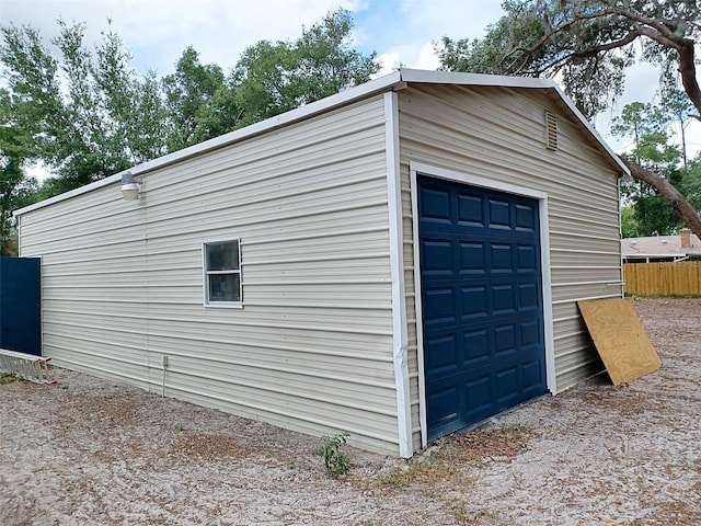 detached garage with fence