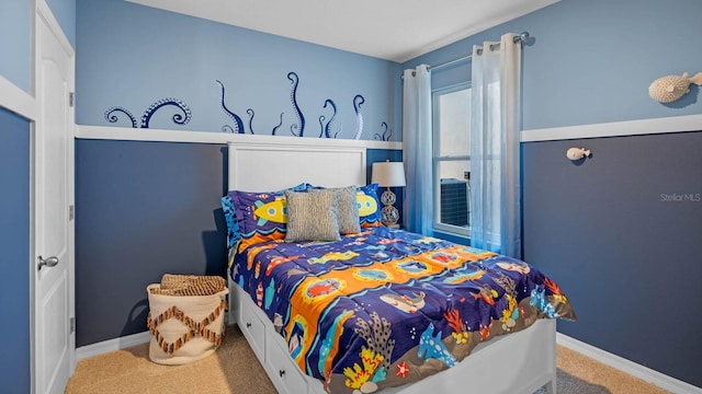 bedroom featuring baseboards and carpet flooring