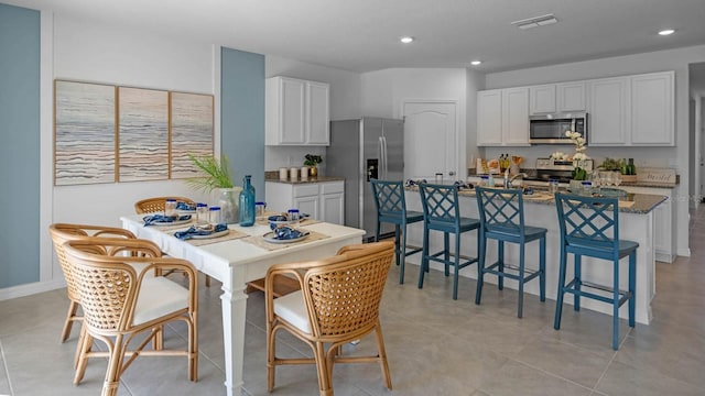 dining area with visible vents, recessed lighting, and light tile patterned flooring