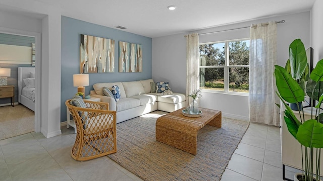 living area with visible vents, recessed lighting, baseboards, and tile patterned floors