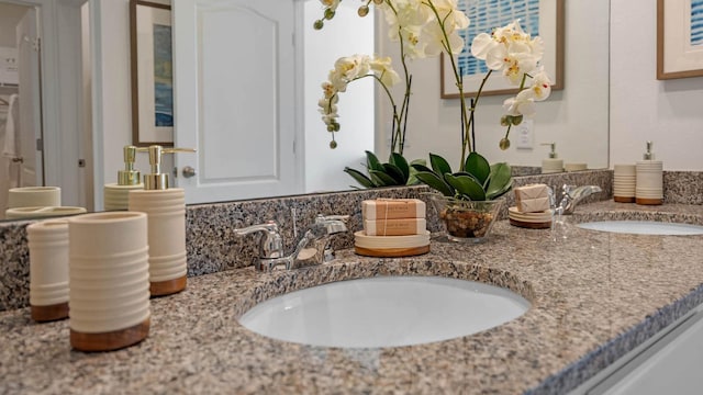 interior space with double vanity and a sink