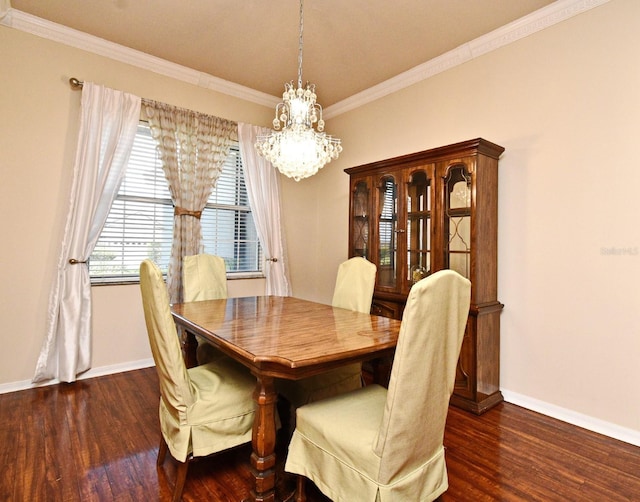 dining room with a chandelier, wood finished floors, crown molding, and baseboards