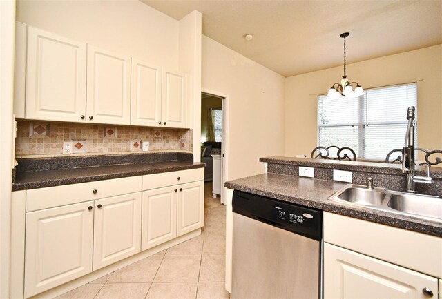 kitchen featuring stainless steel dishwasher, a sink, white cabinets, a chandelier, and light tile patterned floors