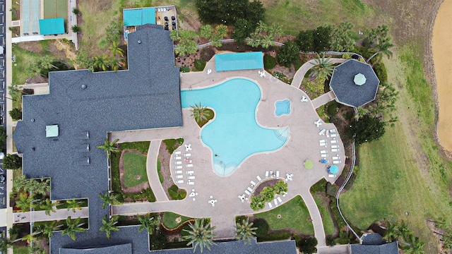 view of property location featuring a pool