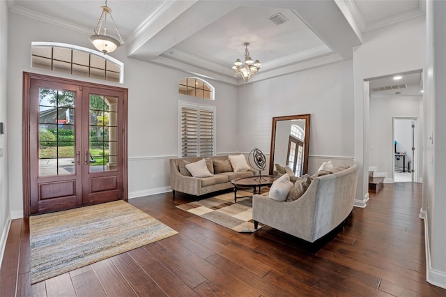 5108 Sailwind Cir, Orlando, FL 32810 - entryway with french doors, dark wood finished floors, a chandelier, baseboards, and crown molding