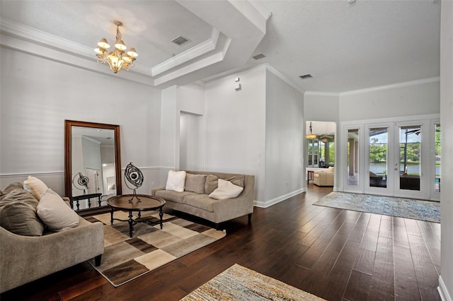 5108 Sailwind Cir, Orlando, FL 32810 - living room featuring a chandelier, crown molding, wood-type flooring, baseboards, and french doors