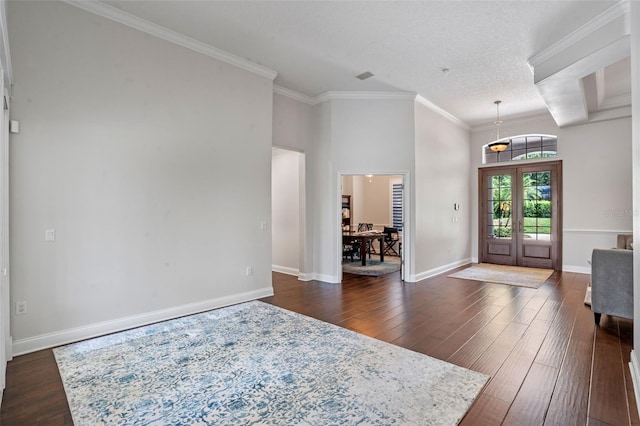 5108 Sailwind Cir, Orlando, FL 32810 - entrance foyer featuring dark wood-style flooring, ornamental molding, french doors, and baseboards
