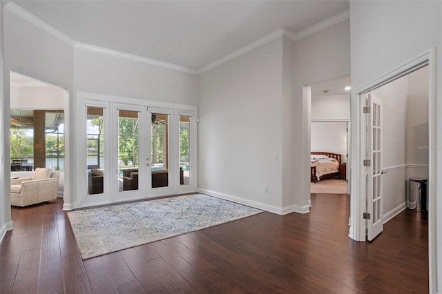 5108 Sailwind Cir, Orlando, FL 32810 - entryway featuring french doors, crown molding, dark wood-type flooring, and baseboards