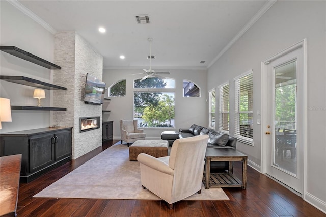 5108 Sailwind Cir, Orlando, FL 32810 - living room with ornamental molding, hardwood / wood-style floors, a fireplace, ceiling fan, and baseboards