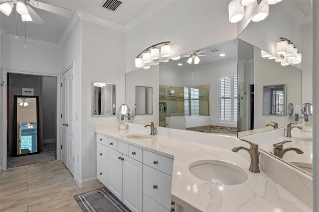 5108 Sailwind Cir, Orlando, FL 32810 - bathroom featuring a ceiling fan, ornamental molding, double vanity, a tile shower, and baseboards