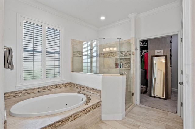 5108 Sailwind Cir, Orlando, FL 32810 - bathroom with a tub with jets, a shower stall, plenty of natural light, and ornamental molding