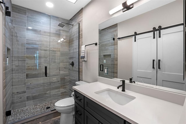 5108 Sailwind Cir, Orlando, FL 32810 - full bathroom with vanity, toilet, a shower stall, recessed lighting, and wood finished floors
