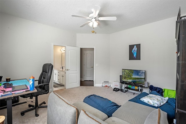 5108 Sailwind Cir, Orlando, FL 32810 - home office featuring carpet flooring, ceiling fan, and a textured ceiling