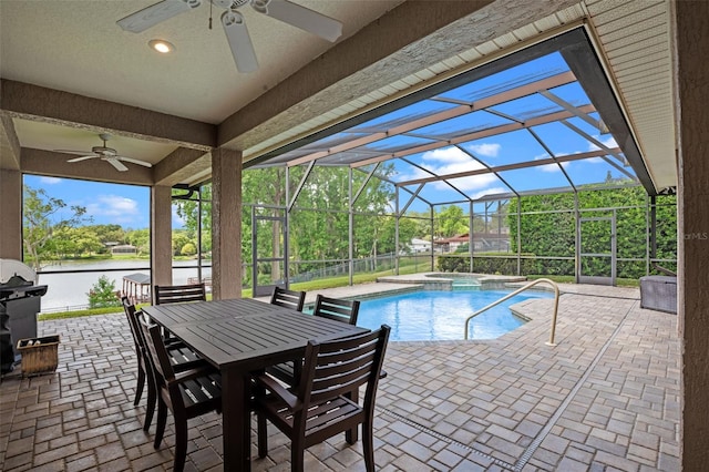 5108 Sailwind Cir, Orlando, FL 32810 - view of pool featuring ceiling fan, a patio, a water view, a pool with connected hot tub, and glass enclosure