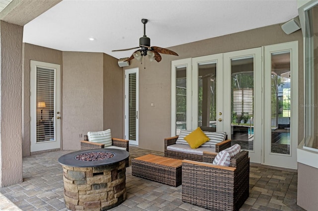 5108 Sailwind Cir, Orlando, FL 32810 - view of patio / terrace featuring french doors, a fire pit, and a ceiling fan